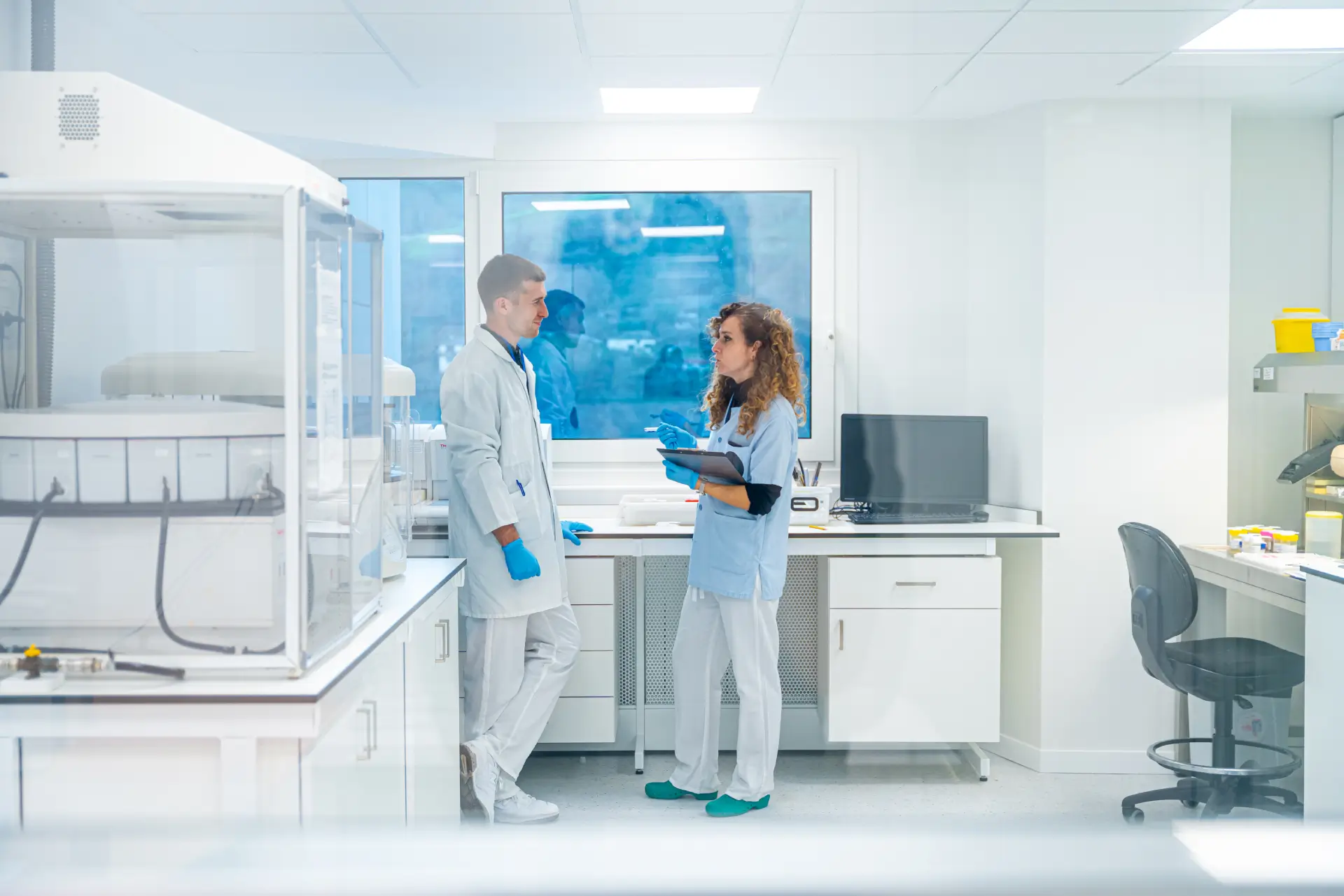 lab technicians discussing DOT drug test results